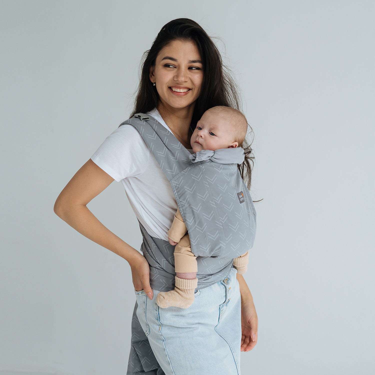 Mom with a baby in a Love & Carry meh dai carrier